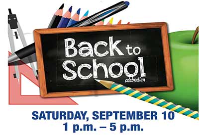 Senator Art Haywood, standing, and staffer Gayle Rider, seated, help sign in constituents during SEPTA Senior Key Photo Day.
